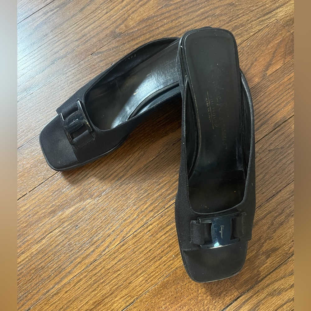 Ferragamo black slip on shoes . Beautiful fabric with wedge heels.